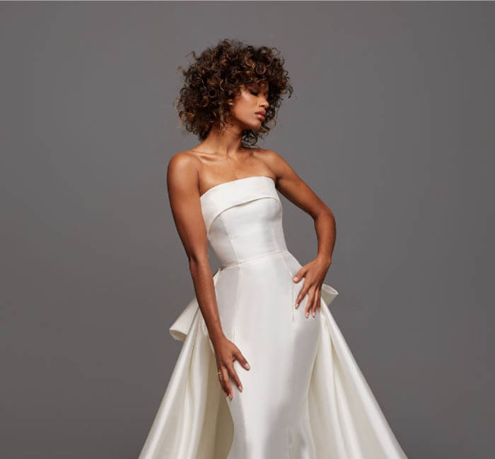 Model wearing a gown by Ashley & Justin